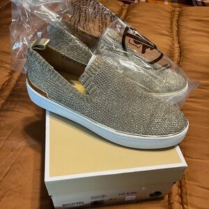 Women’s Michael Kors gold metallic slip on shoes. Brand New. Size 8.5 M.
